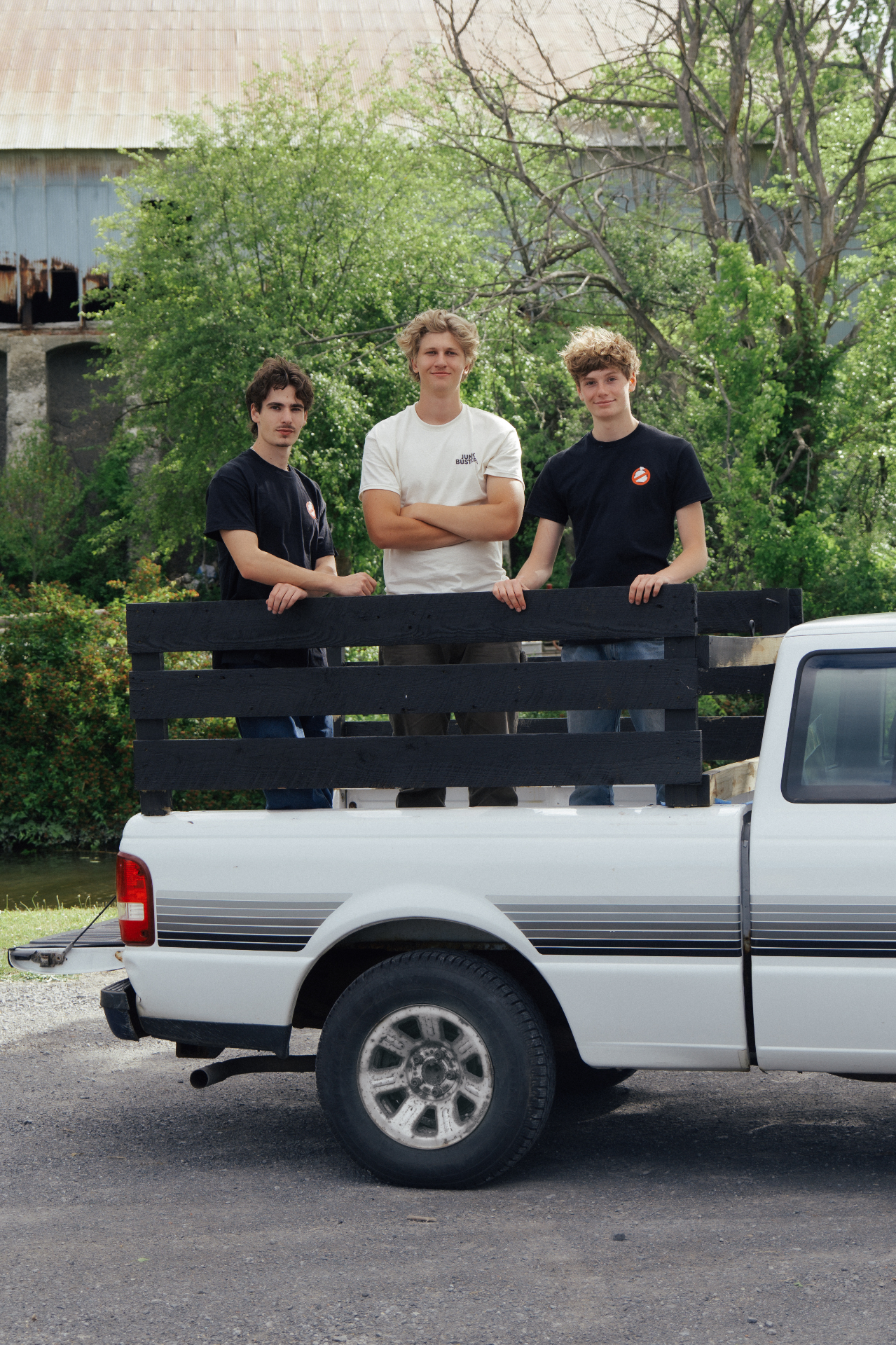 Junk Busters team behind their truck